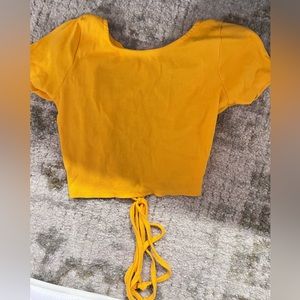 Orange crop top with open back